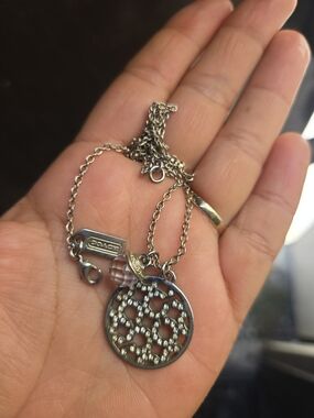 Coach Silver-Tone Crystal Logo Pendant Necklace with Pink Faceted Charm